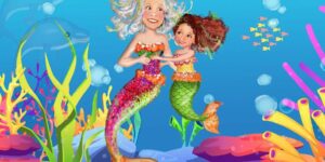 A picture of two mermaids in the ocean.